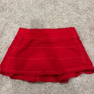 pace rival mid rise skirt in red!